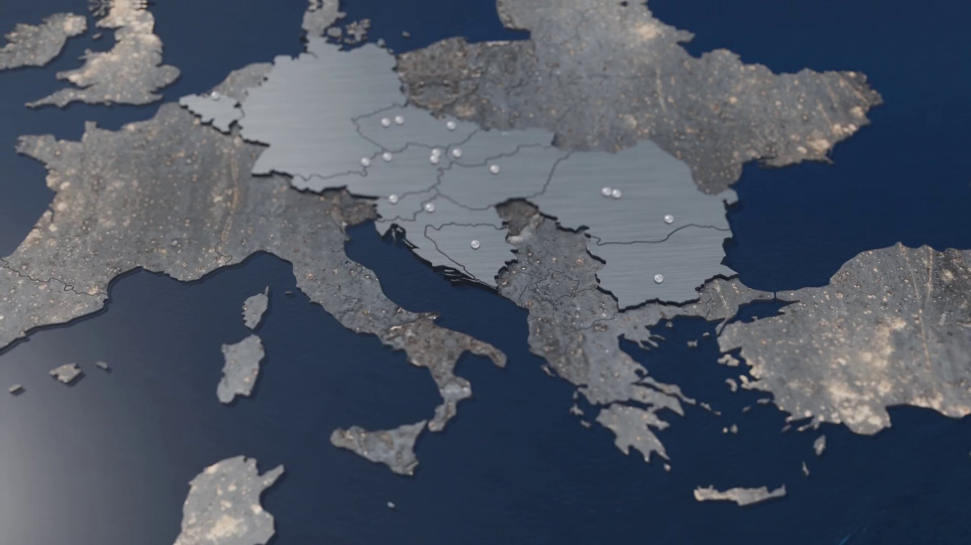 Europe cut from steel plate on a deep blue sea: the countries of the FRANKSTAHL group in polished steel, each location a steel ball.